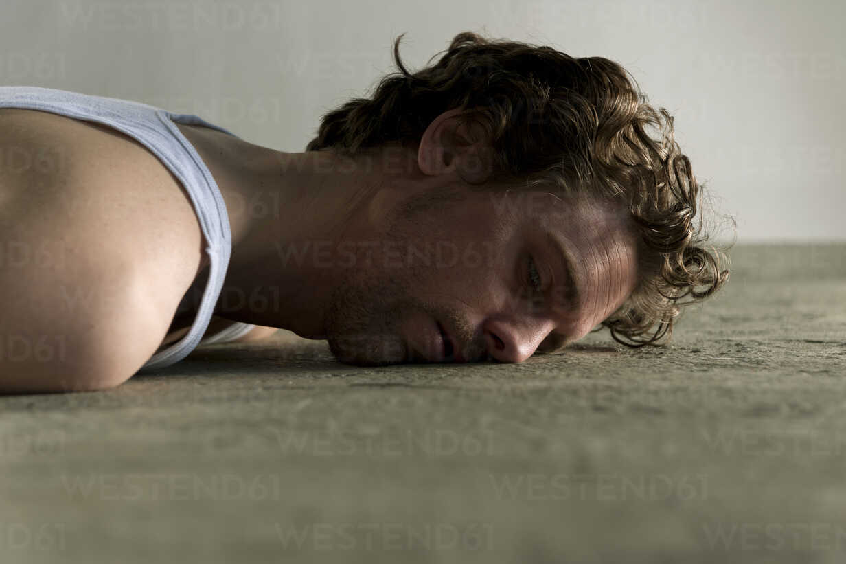 Mid Adult Man Lying On Floor With Face Down Dbf000092 Daniel