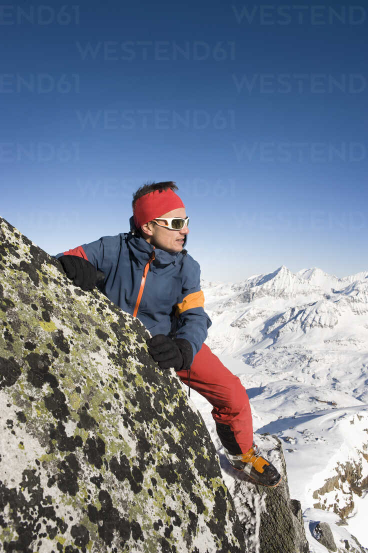 Austria Man Trekking On Peak At Salzburger Land Stockphoto