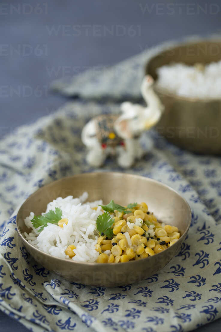 Cooked basmati rice and yellow lentils with mustard seeds ...