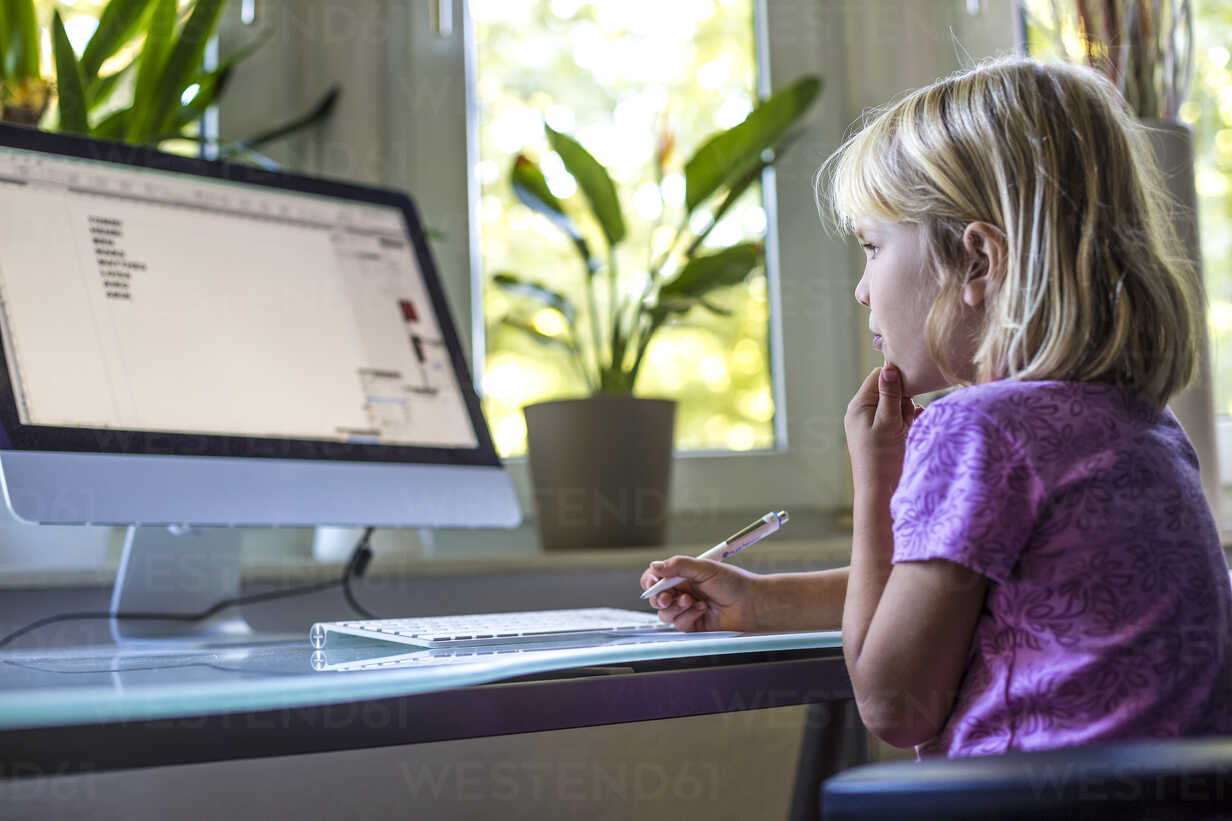 Little Girl Looking At Computer Monitor At Home Jfef000733 Jana