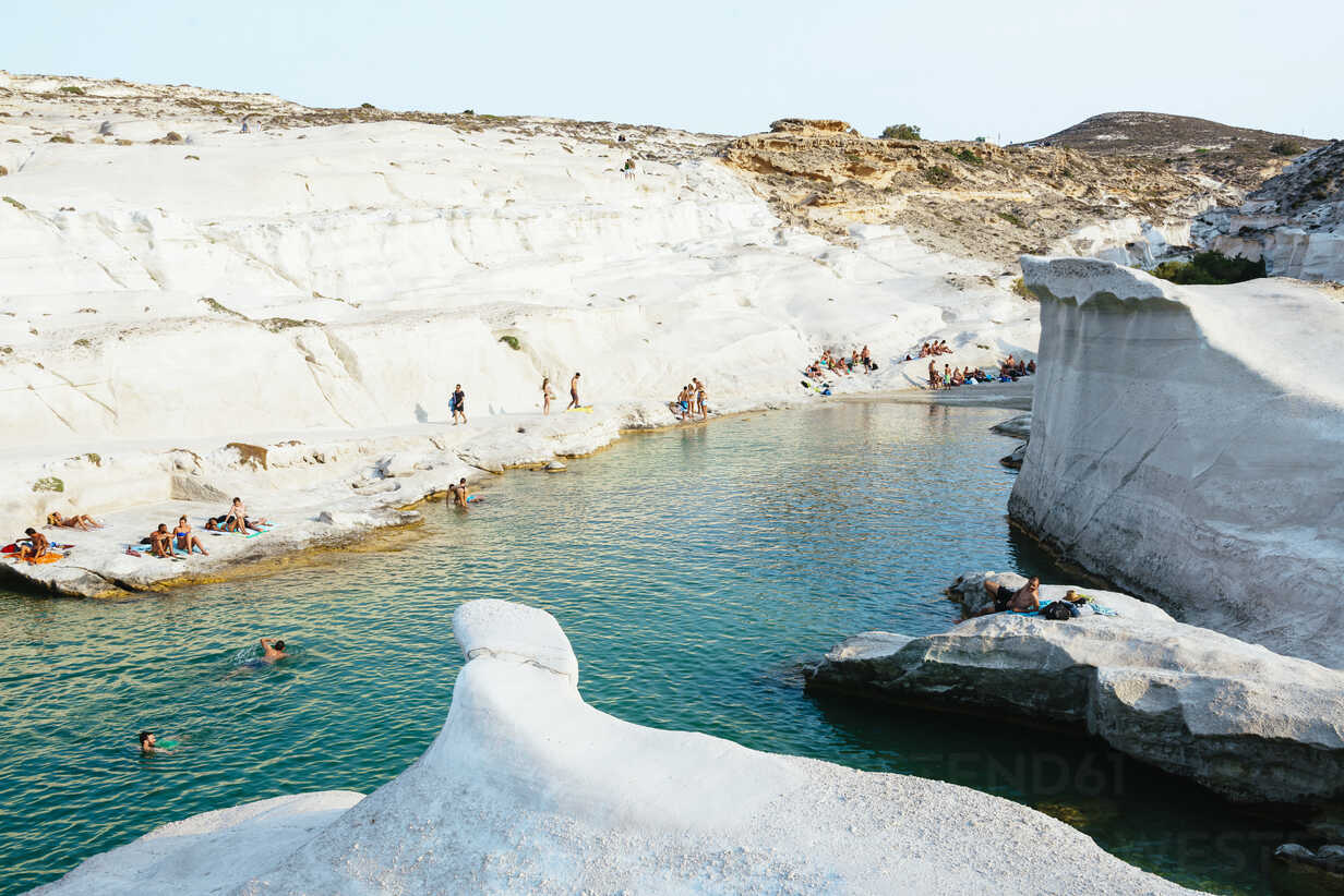 Greece Milos People On The White Rocks In Sarakiniko Stockphoto