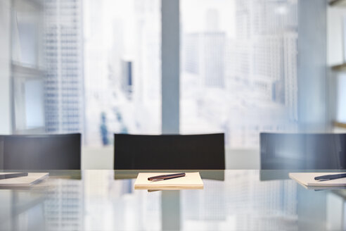 Part Of Modern Conference Room With Table Chairs Notepads And Pens Stockphoto