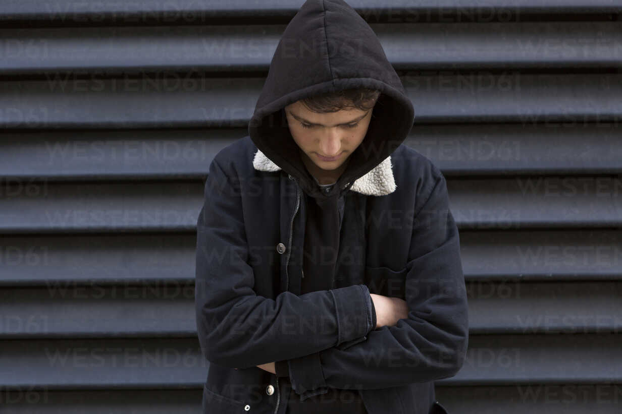 Teenage Boy In Front Of Black Background Wearing Hooded Jacket Junf Jlpfeifer Westend61