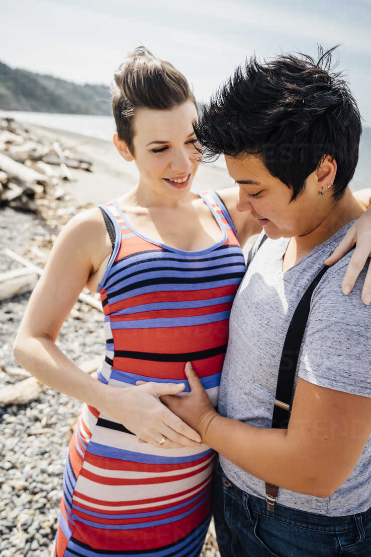 Pregnant Lesbian Couple Hugging On Beach Blef Inti St Clair Westend61