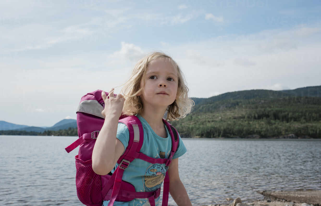 Portrait Of A Young Girl Hiking With A Backpack By The Sea Cavf Cavan Images Westend61