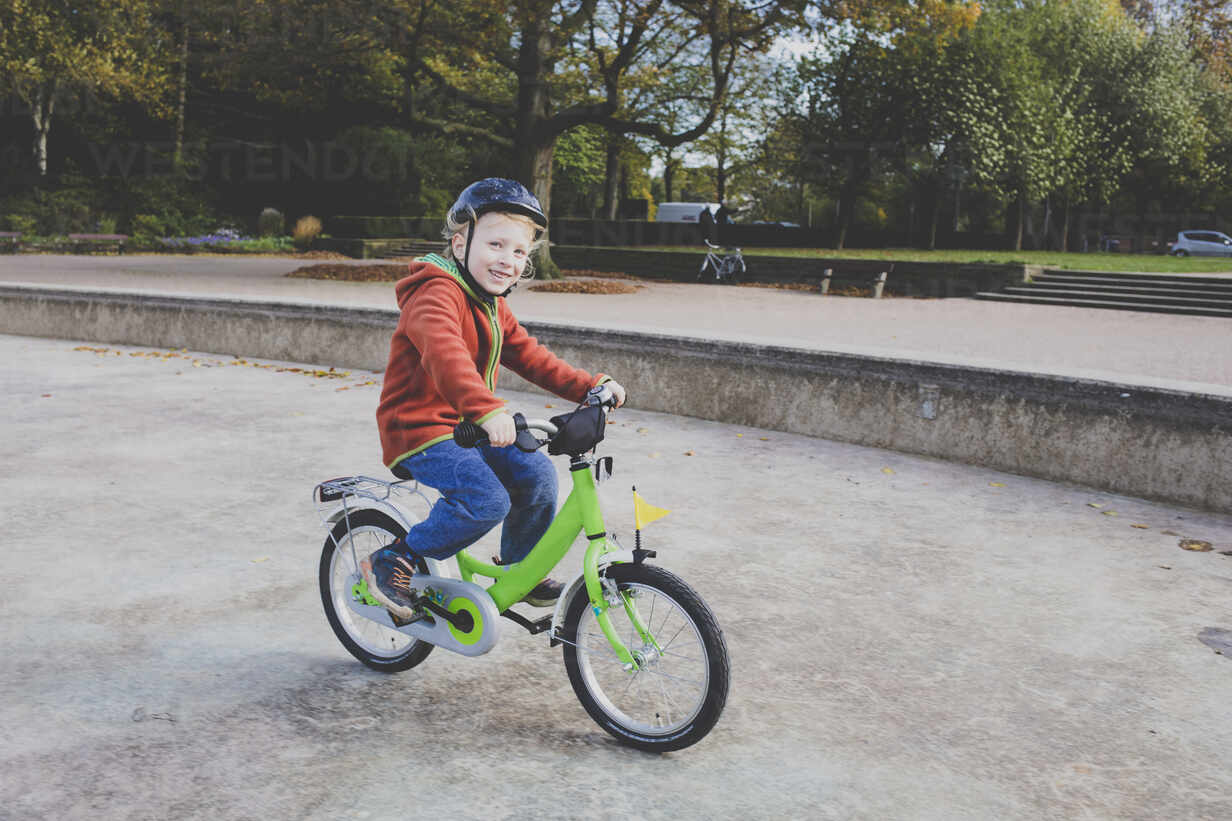 little boy riding bicycle