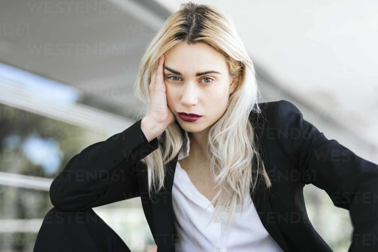 Portrait Of Young Businesswoman With Dyed Blond Hair Wearing Black Pantsuit Tcef00579 Tania Cervian Westend61