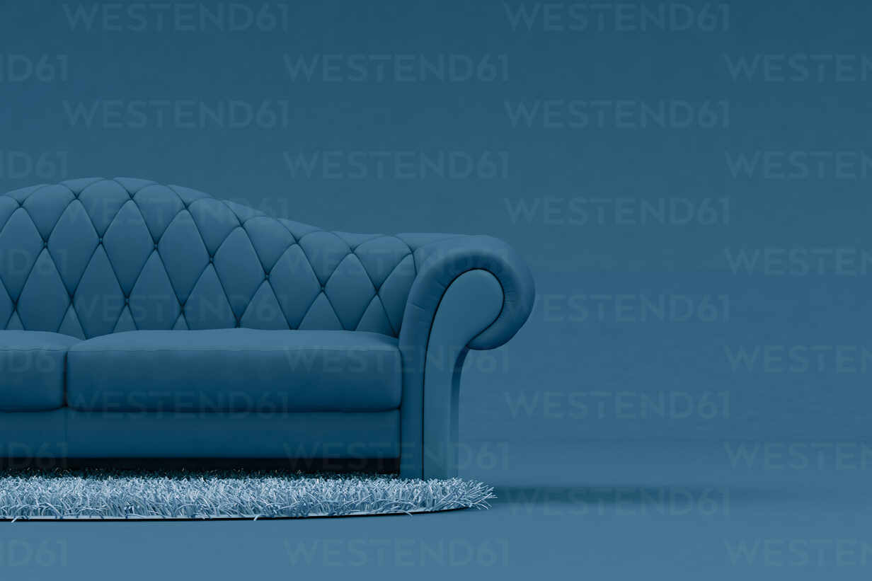 Blue Sofa With Light Blue Rug Stockfoto